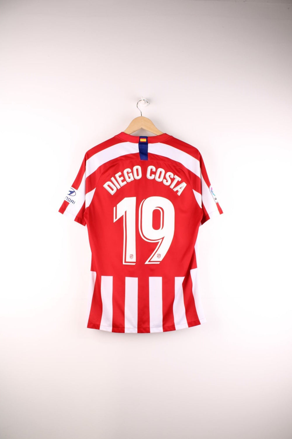 Atletico Madrid 2019/20  Football Shirt in the  and white home kit colourway, features embroidered logos and badge on the front and Diego Costa number 19 printed on the back.