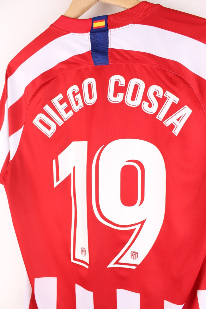 Atletico Madrid 2019/20  Football Shirt in the  and white home kit colourway, features embroidered logos and badge on the front and Diego Costa number 19 printed on the back.