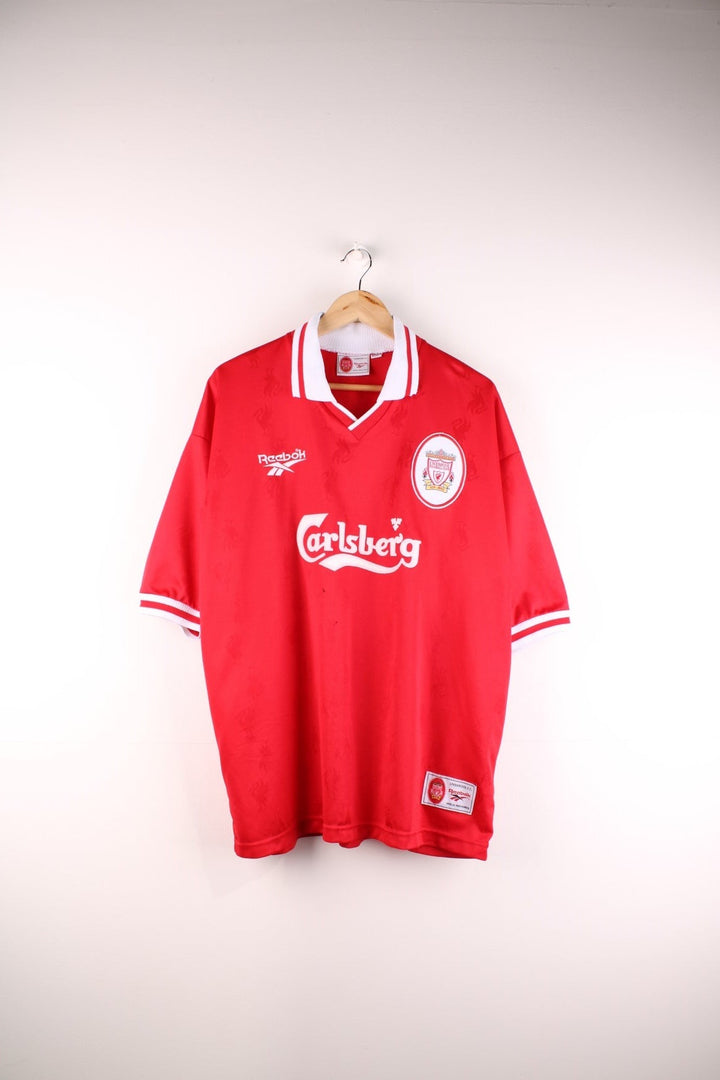 Liverpool 1996/98 Reebok Football Shirt in the red home kit colourway, features v neck collar and embroidered logos and badge on the front.