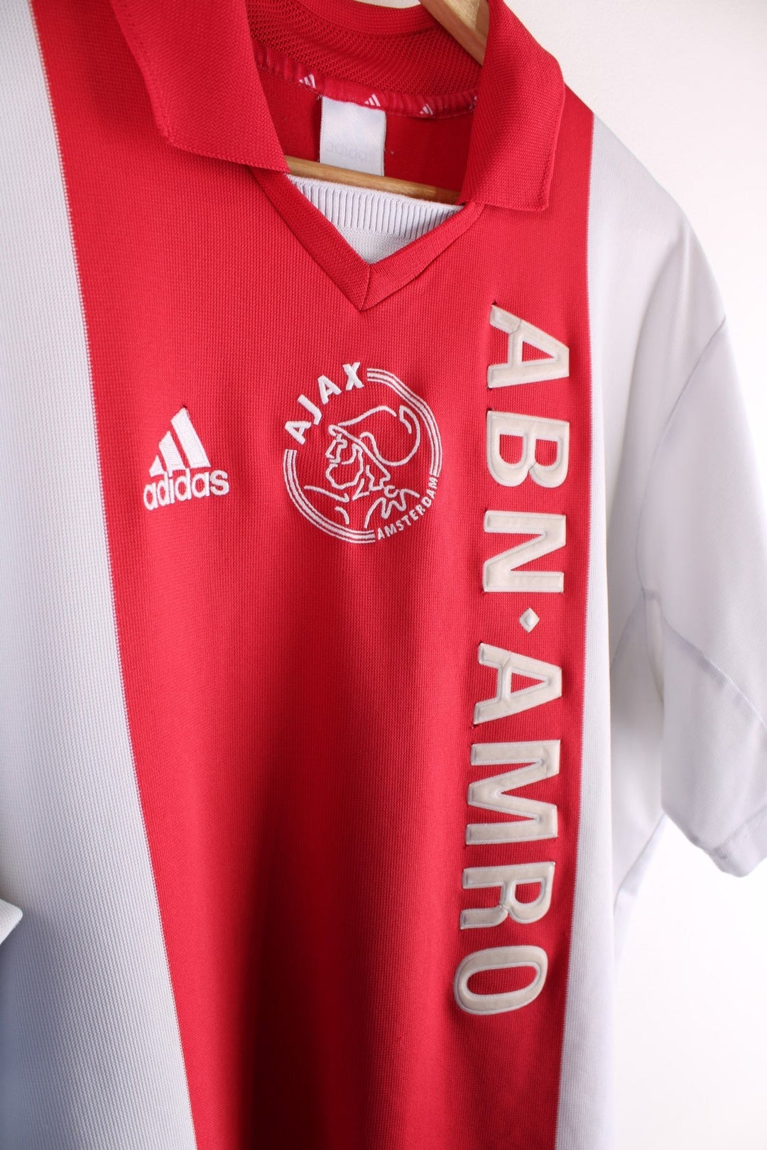 Ajax 2001/02  Football Shirt in the  and white home kit colourway, features embroidered logos and badge on the front.