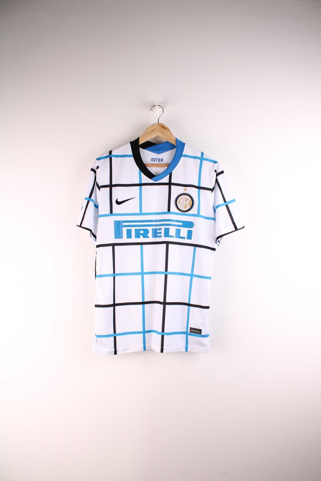 Inter Milan 2020/21 Nike Football Shirt in the white, blue and black striped away kit colourway, features embroidered logos and badge on the front.