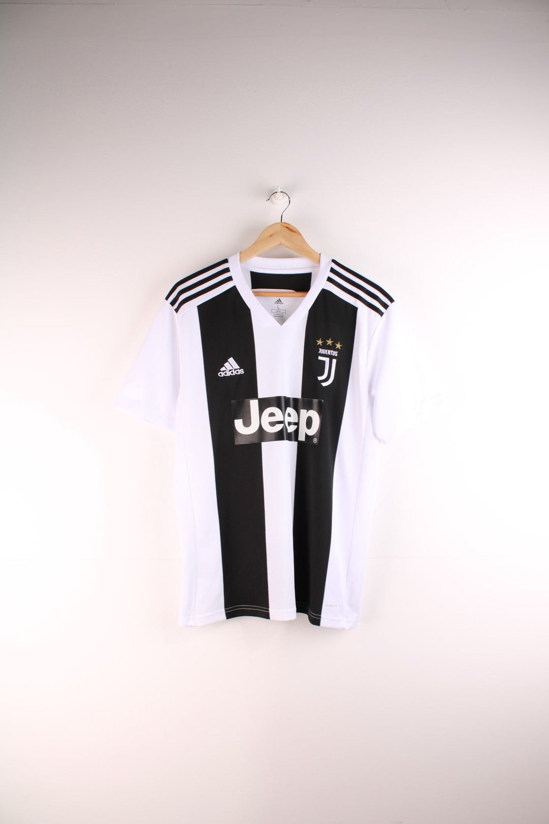 Juventus 2018/19 Adidas Football Shirt in the white and black home kit colourway, features embroidered logos and badge on the front and on the back has Cristiano Ronaldo number 7 printed on the back.