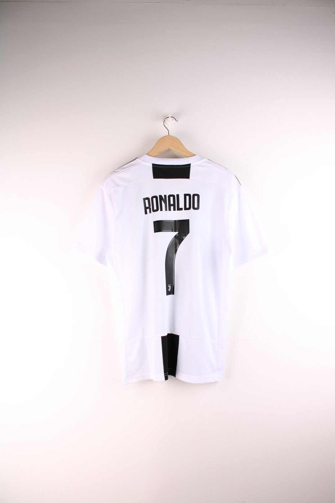 Juventus 2018/19  Football Shirt in the  and black home kit colourway, features embroidered logos and badge on the front and on the back has Cristiano Ronaldo number 7 printed on the back.