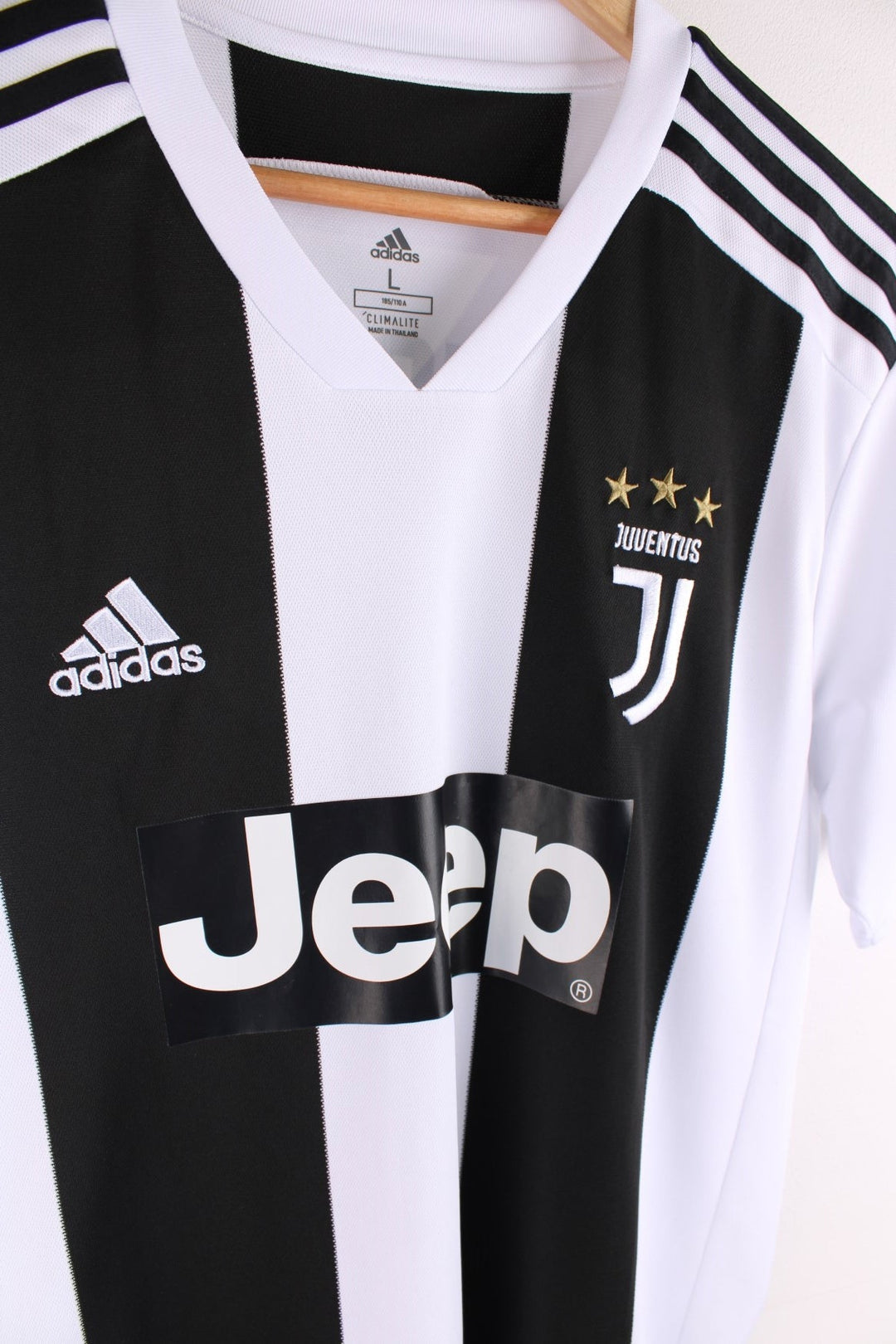 Juventus 2018/19  Football Shirt in the  and black home kit colourway, features embroidered logos and badge on the front and on the back has Cristiano Ronaldo number 7 printed on the back.