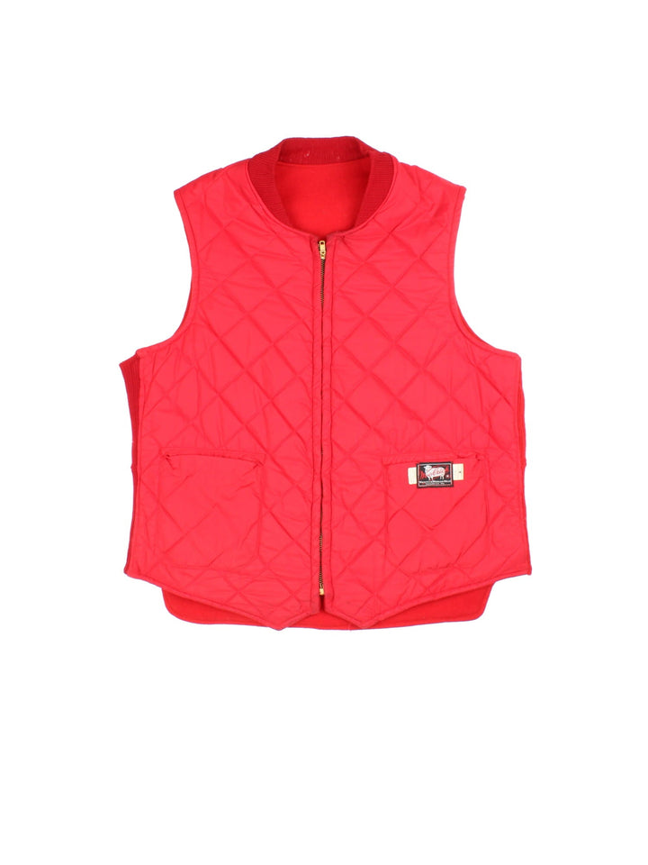 Vintage Woolrich Reversible Gilet in a red colourway with either wool or quilted shell options. Zips up and has multiple pockets, and the logo tab embroidered on the front of the quilted side.