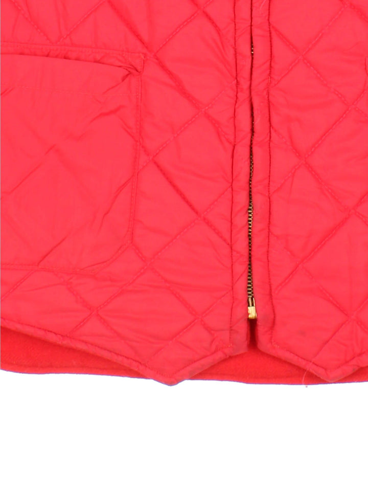 Vintage Woolrich Reversible Gilet in a red colourway with either wool or quilted shell options. Zips up and has multiple pockets, and the logo tab embroidered on the front of the quilted side.