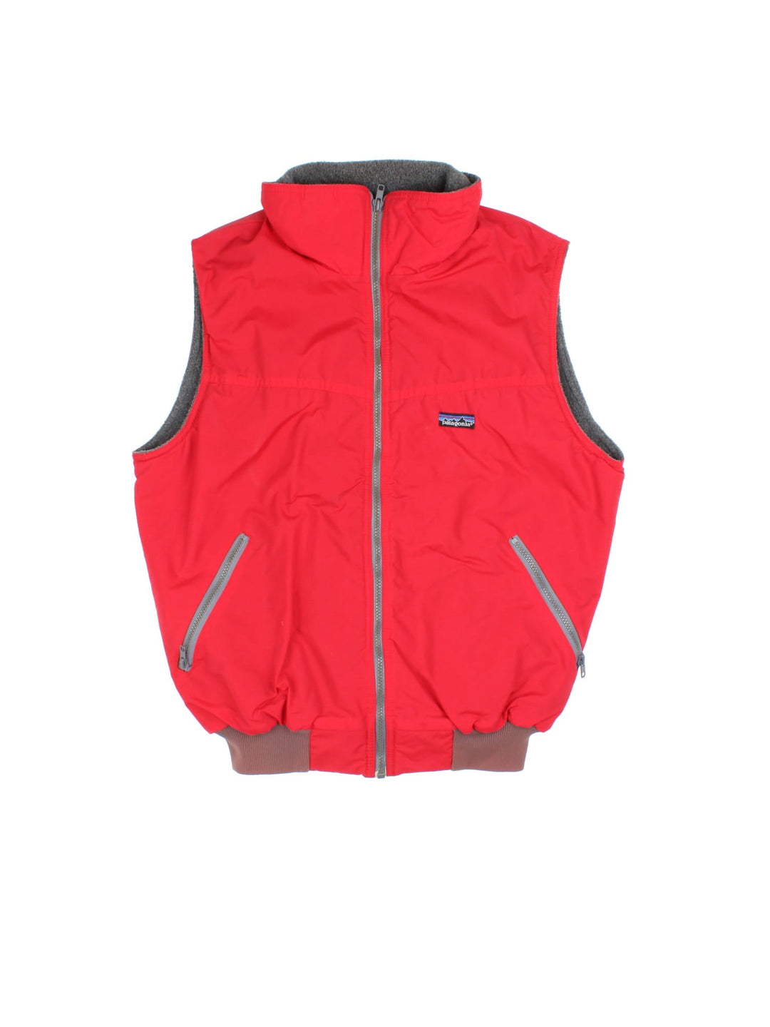 Vintage Patagonia Gilet in a red colourway. Zips up and has side pockets, insulated with a fleece lining, and has the logo embroidered on the front.