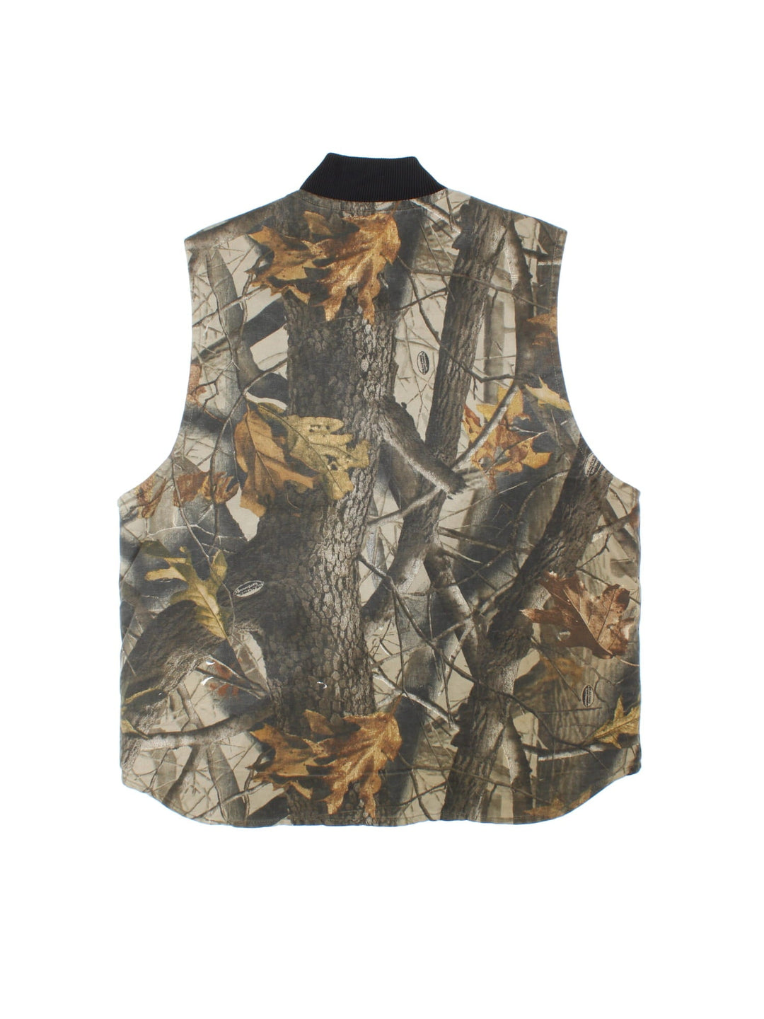 Vintage Carhartt Real Tree Camo Gilet in a green, brown and black patterned colourway. Zips up and has side pockets, insulated with a quilted lining, and has the logo embroidered on the front.