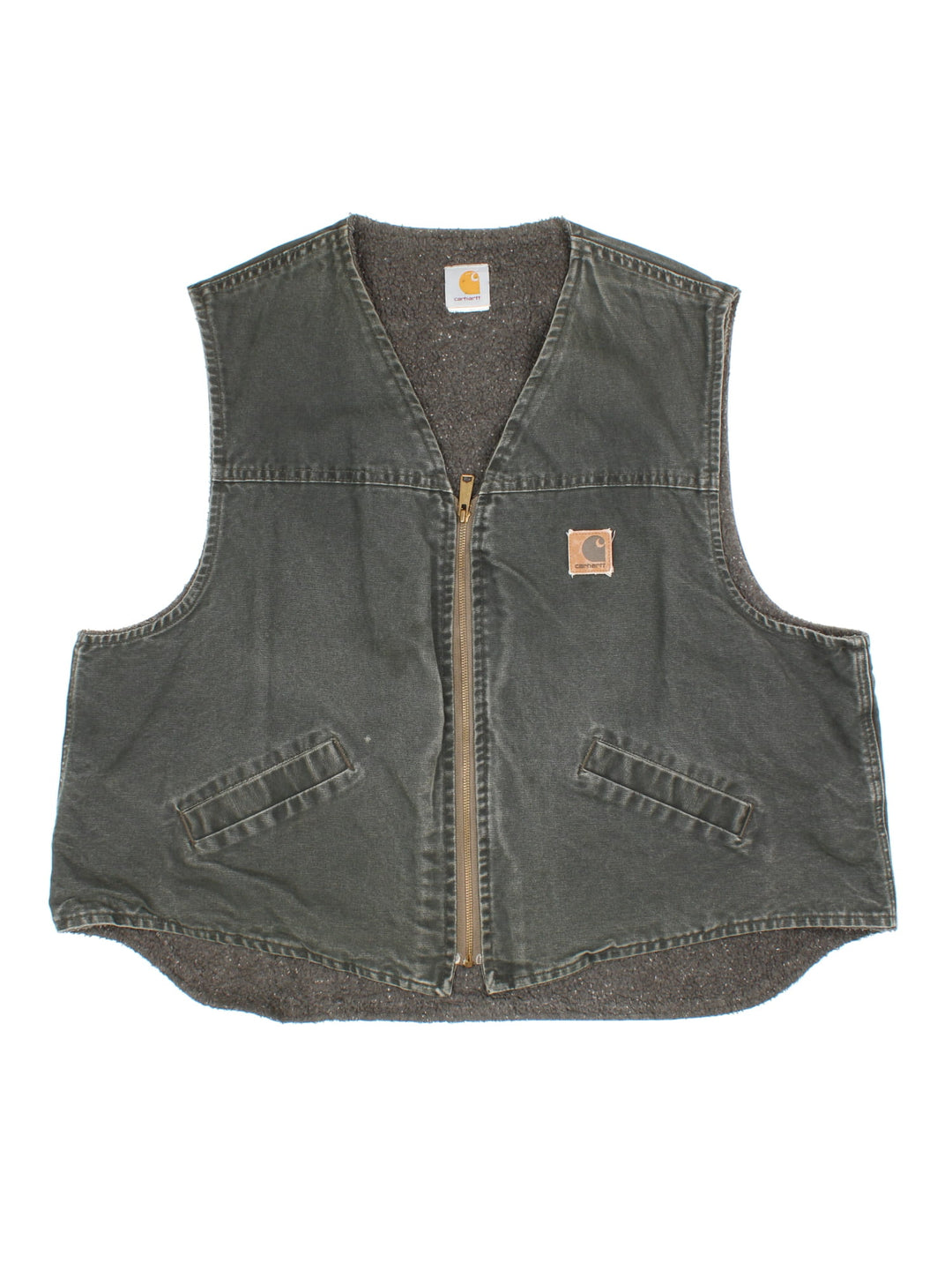 Vintage Carhartt Gilet in a green colourway. Zips up and has side pockets, insulated with a fleece lining, and has the logo embroidered on the front.