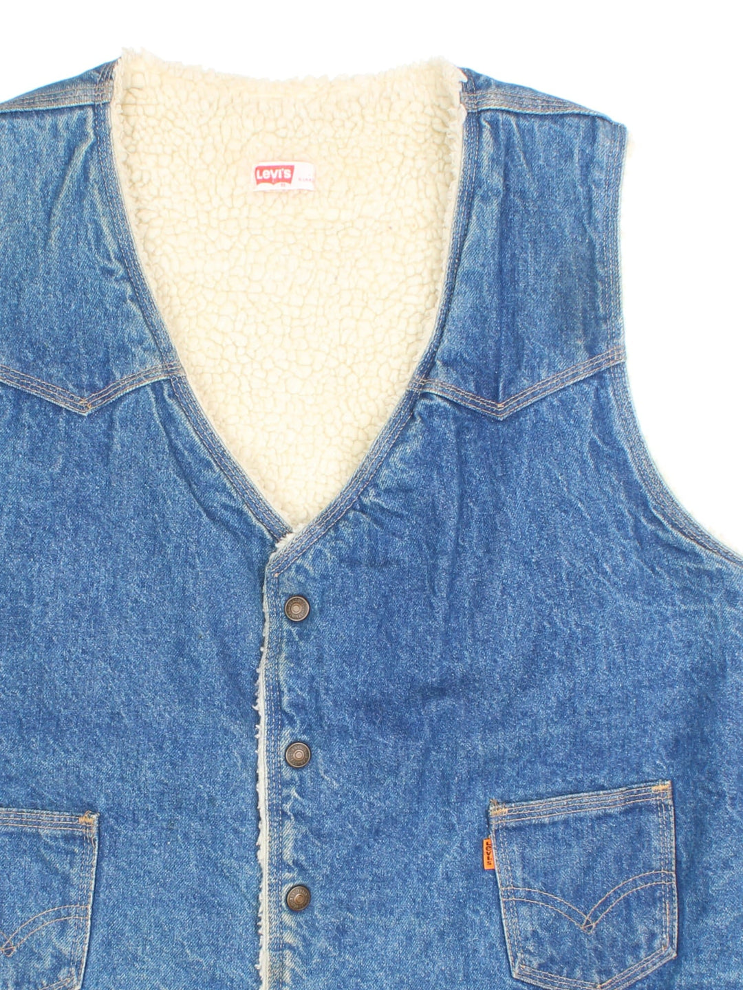 Vintage Levi Strauss Denim Vest in a blue colourway. Buttons up and has side pockets, insulated with a sherpa lining, and has the orange logo tab embroidered on the front.