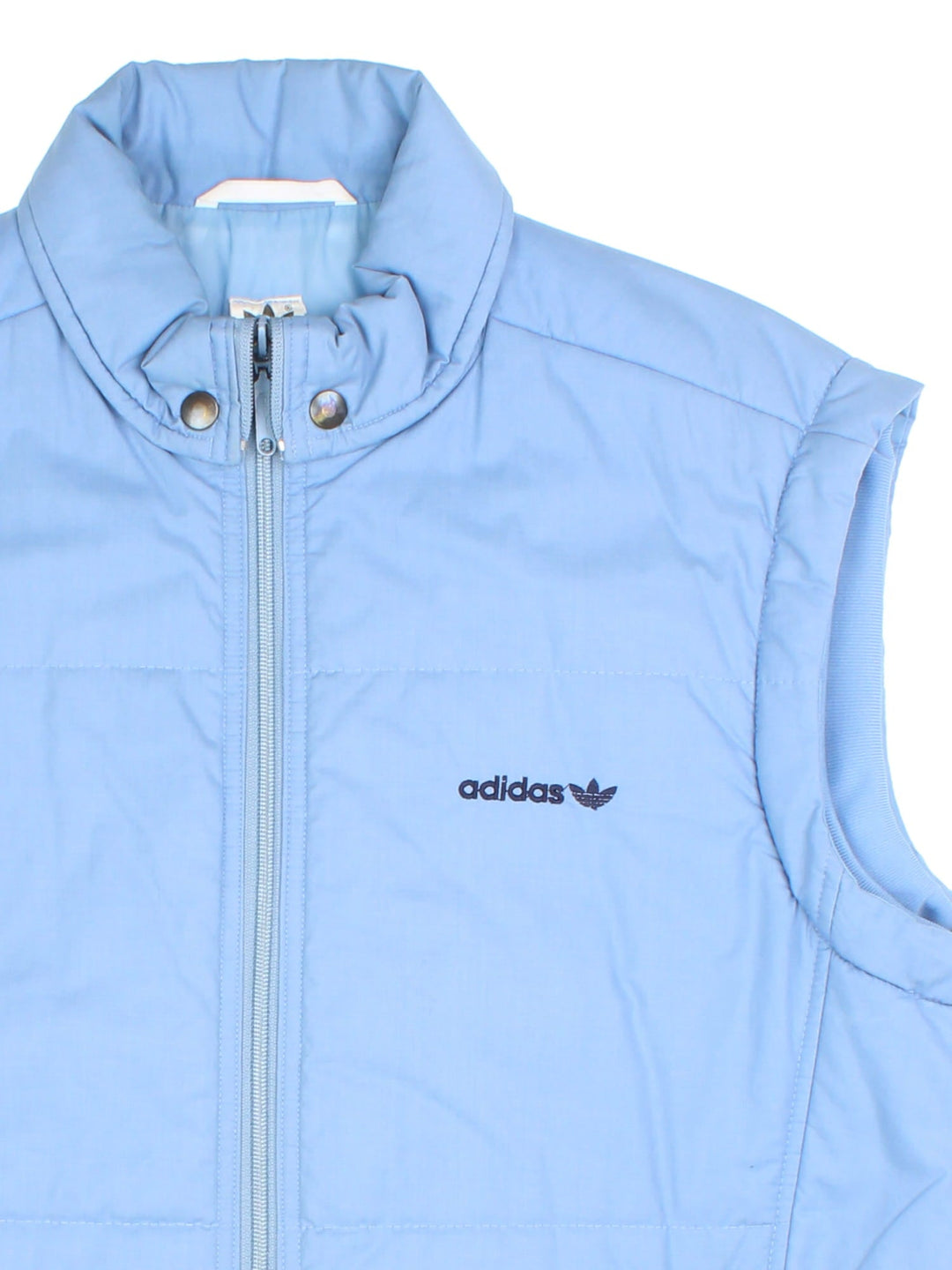 Vintage Adidas Gilet in a blue colourway. Zips up and has side pockets, insulated lining, and has the logo embroidered on the front.