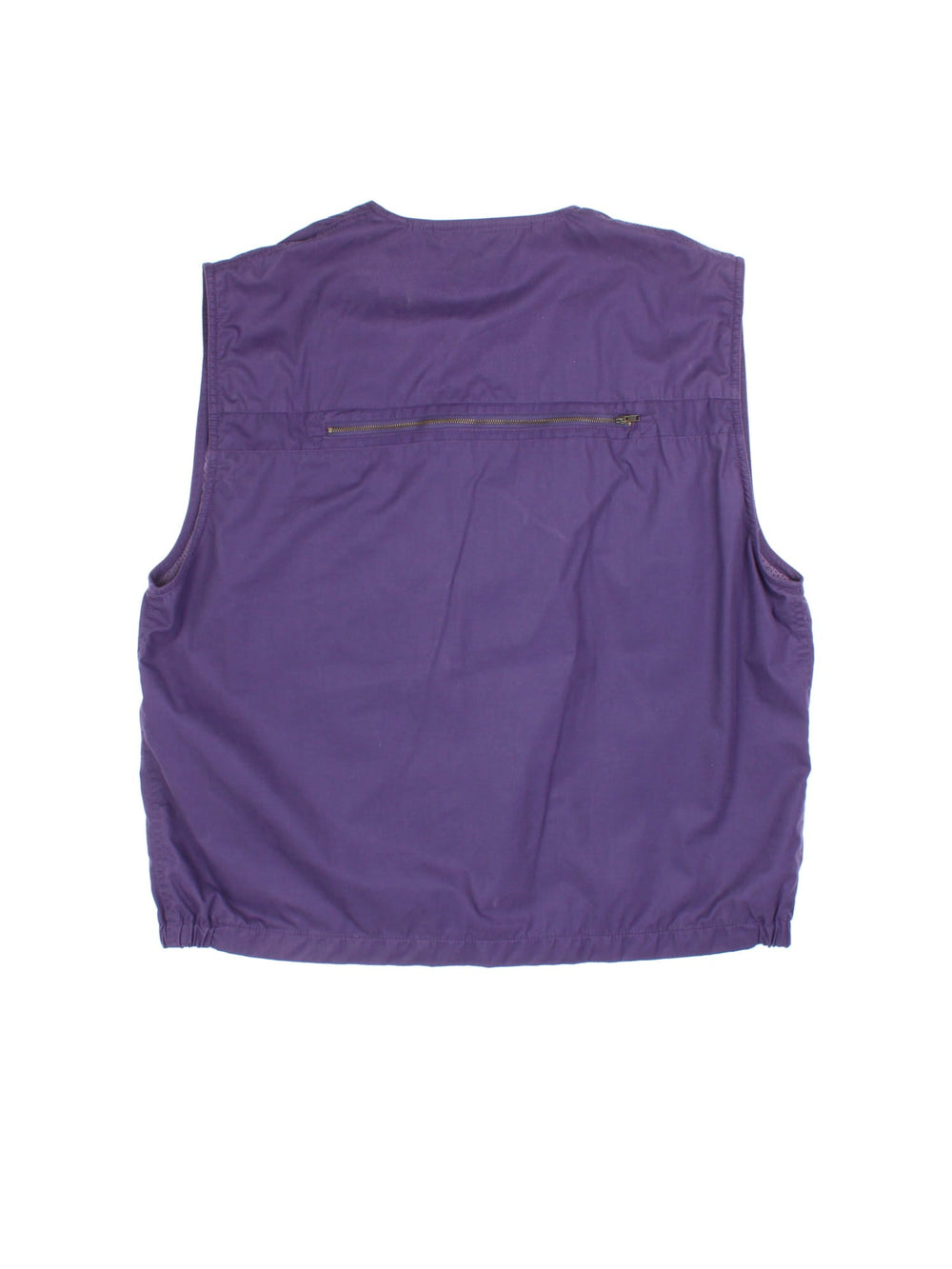 Vintage Puma Pursuit Utility Vest in a purple colourway. Zips up and has multiple pockets, mesh lining, and has the logo embroidered on the front.