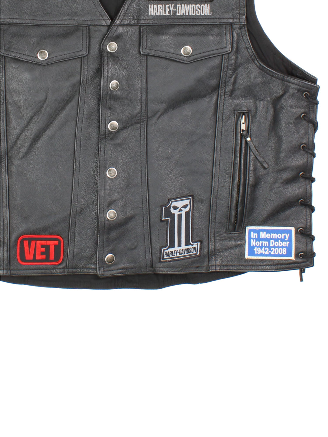 Vintage Harley-Davidson Leather Biker Vest in a black colourway. Buttons up and has multiple pockets, and has embroidered logos and badges on the front.