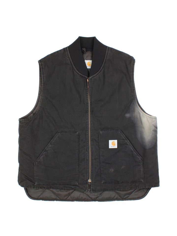 Vintage Carhartt Gilet in a black colourway. Zips up and has side pockets, insulated with a quilted lining, and has the logo embroidered on the front.