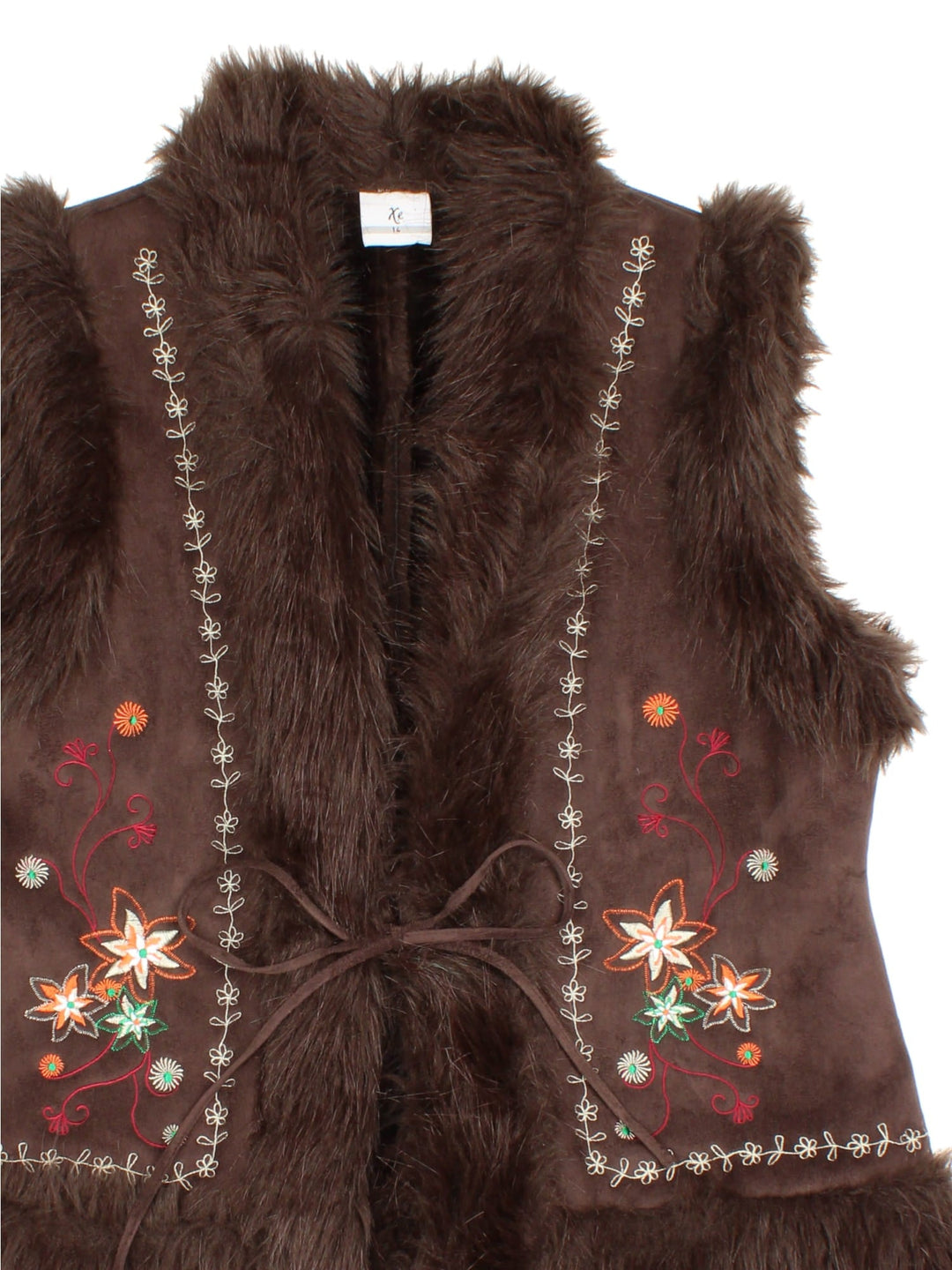 Y2K Floral Faux Fur Vest in a brown colourway. Ribbon closure, has side pockets, faux fur lining, and has floral patterns embroidered on the front.