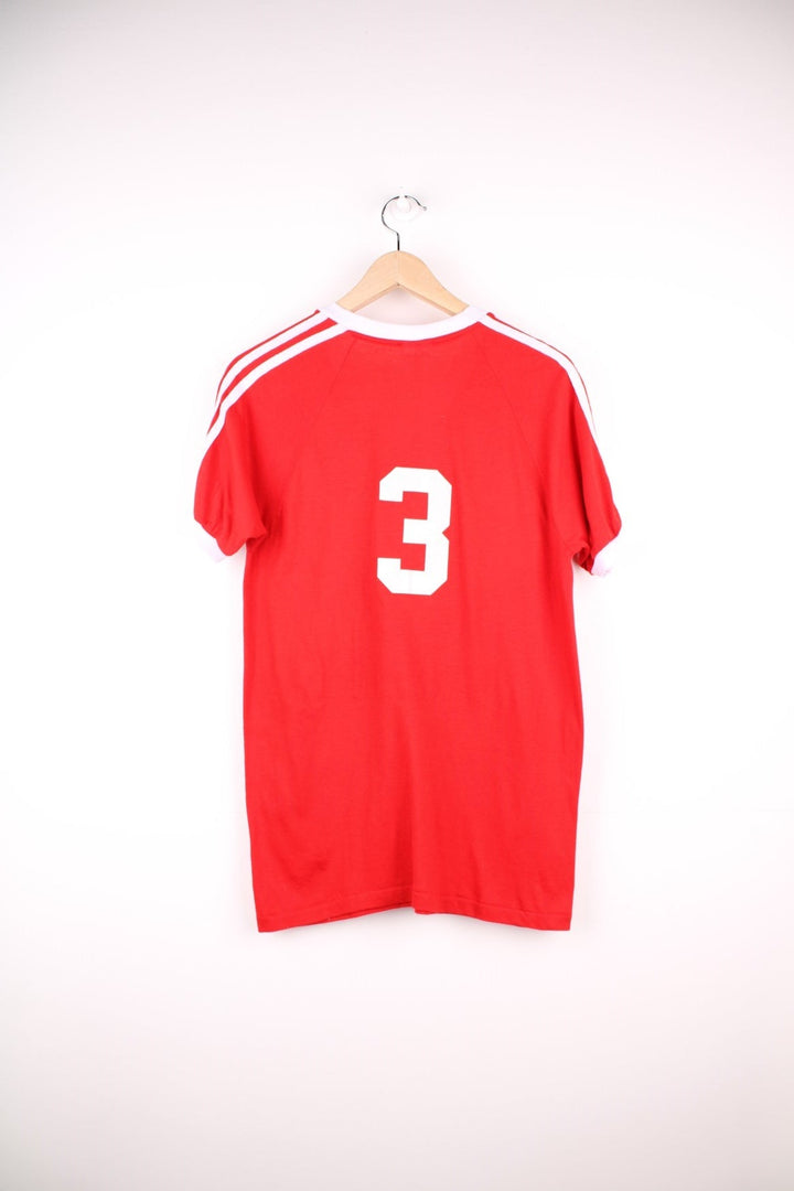 Vintage 70's Hinshaw Baseball T-Shirt in a red and white colourway, has a v neck collar, stripes going down the sleeves, and 'Hinshaw' spell out printed on the front as well as the number 3 on the back. 