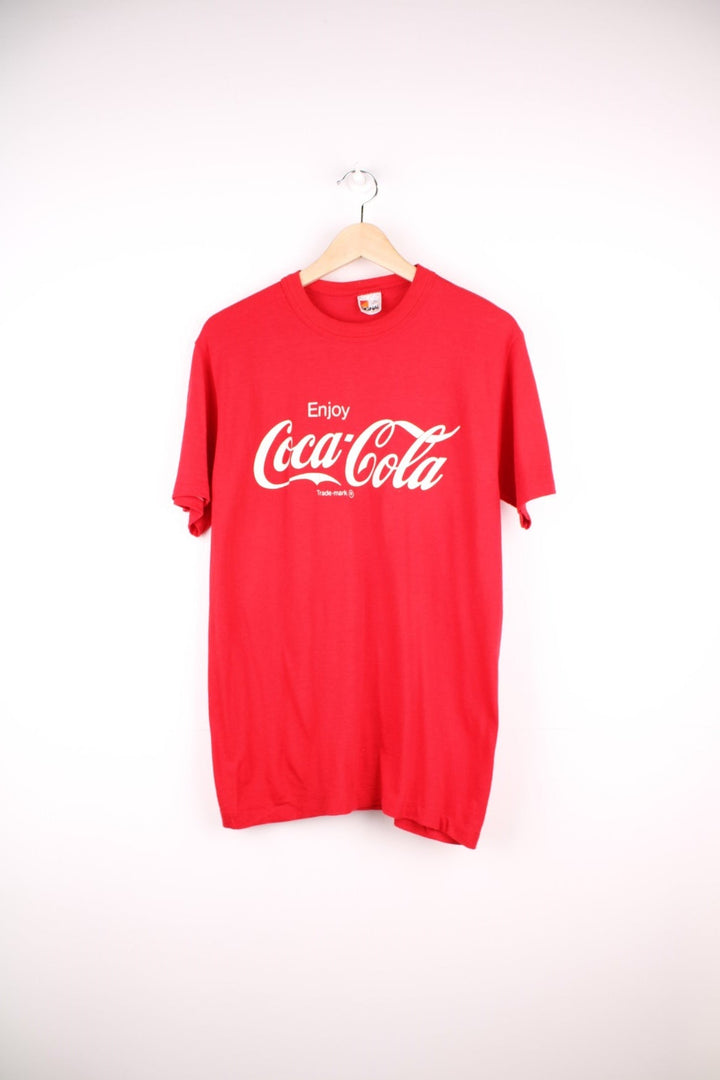 Vintage 90's Coca Cola T-Shirt in a red and white colourway with the spell out logo printed across the front. 