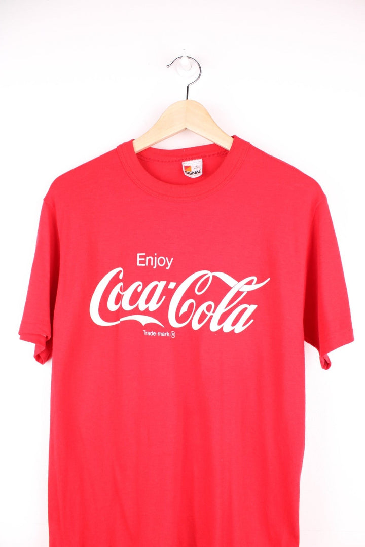 Vintage 90's Coca Cola T-Shirt in a red and white colourway with the spell out logo printed across the front. 