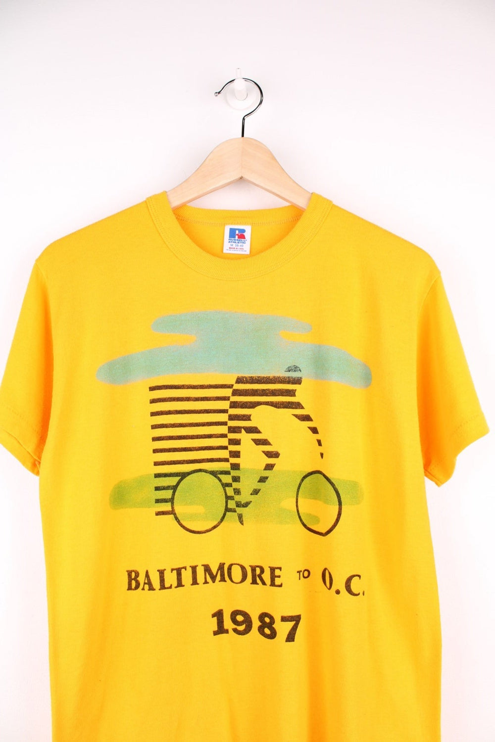 Vintage 1987 Baltimore to O.C. Cyclist T-Shirt in a yellow colourway with the spell out logo and cyclist graphic printed on the front. 