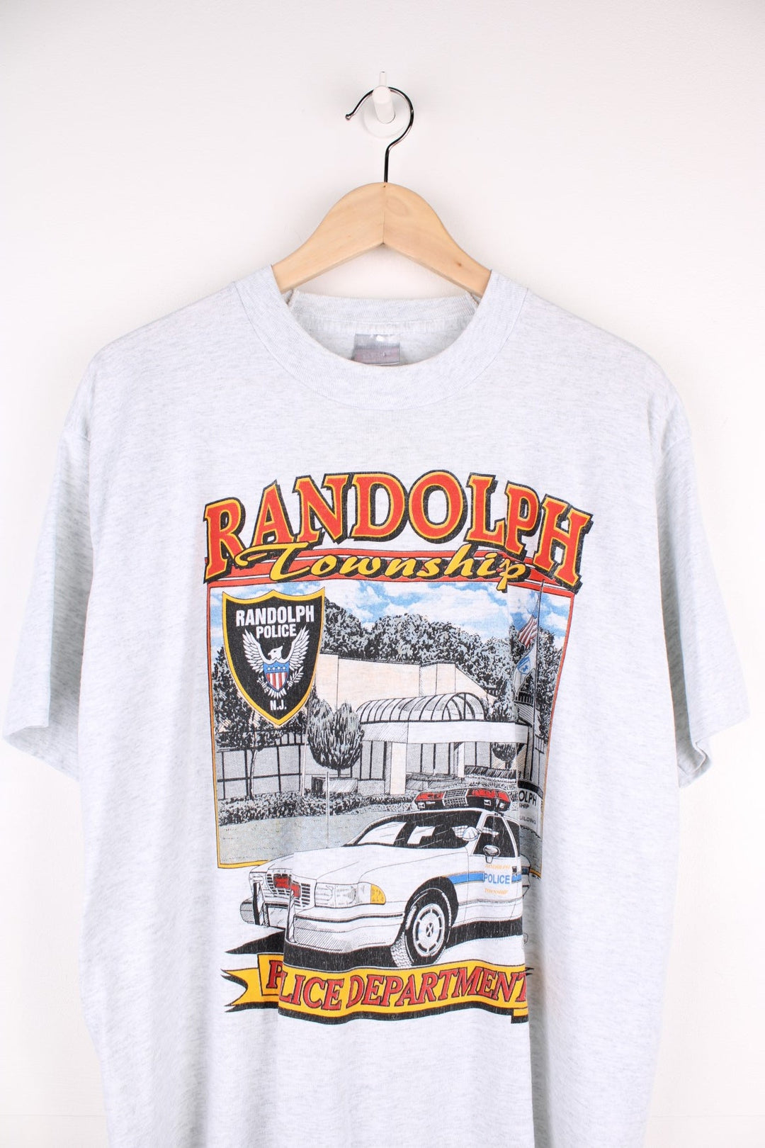 Vintage 1995 Randolph Township Police Department Graphic T-Shirt in a grey colourway with the police station and car graphic printed on the front.