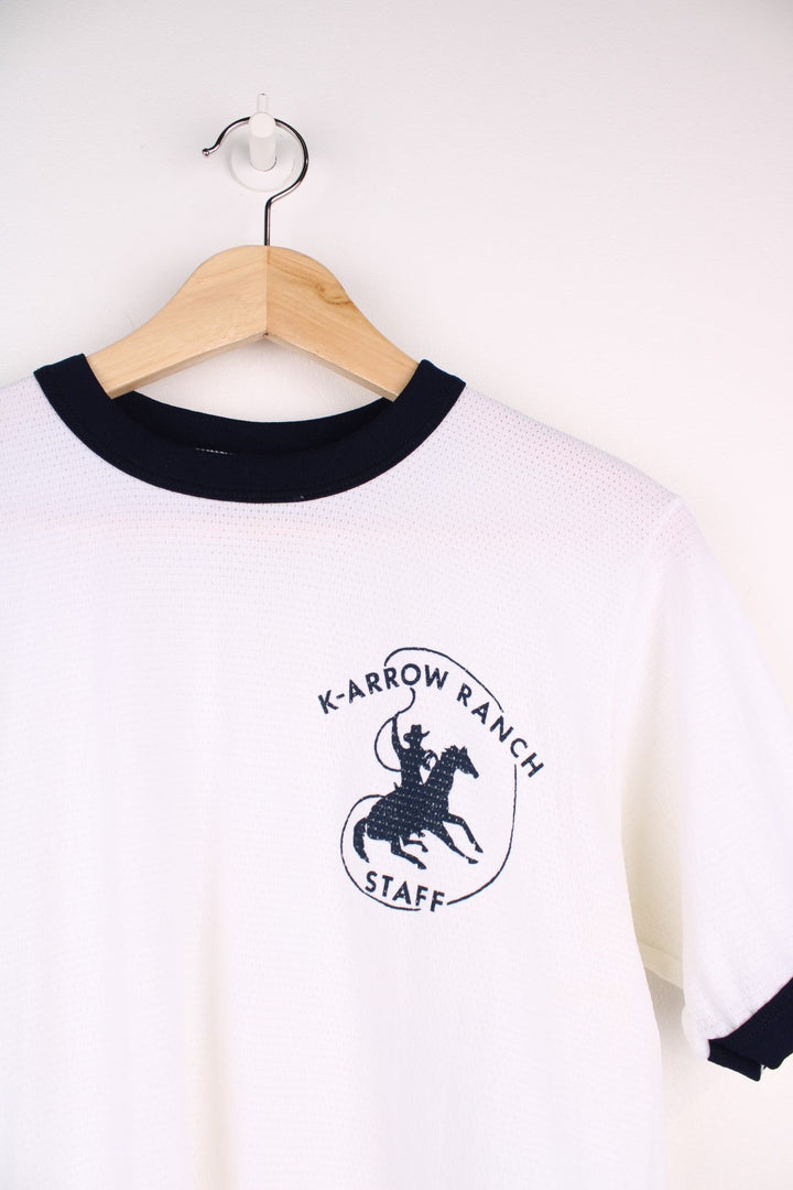  80's Cowboy K-Arrow Ranch Ringer T-Shirt in a  colourway with navy blue cuffs, and has the logo printed on front.