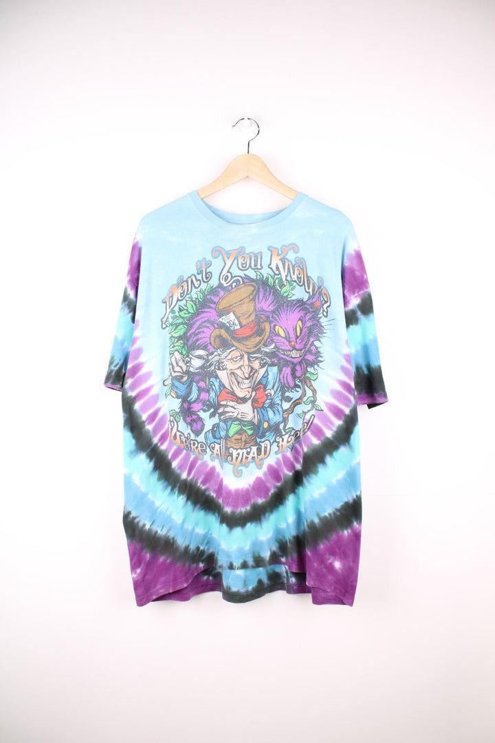 Alice in Wonderland T-Shirt in a multicoloured tie dye colourway with cartoon graphic printed on the front with 'Don't you know you're all mad here' spell out around it. 