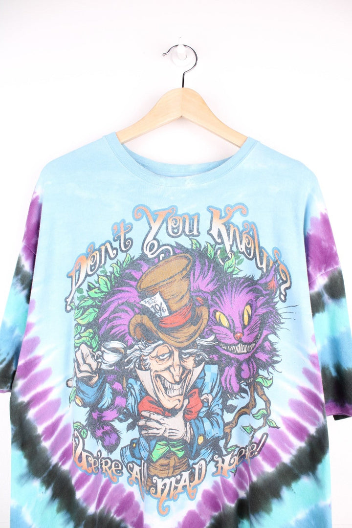 Alice in Wonderland T-Shirt in a multicoloured tie dye colourway with cartoon graphic printed on the front with 'Don't you know you're all mad here' spell out around it. 