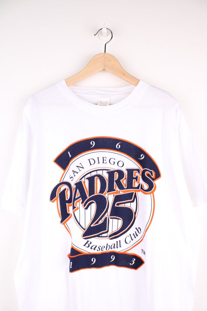 Vintage 90's San Diego Padres MLB Graphic T-Shirt in a white colourway with the team logo printed on the front and on the back is the 'News at 10' spell out logo, single stitch t-shirt. 