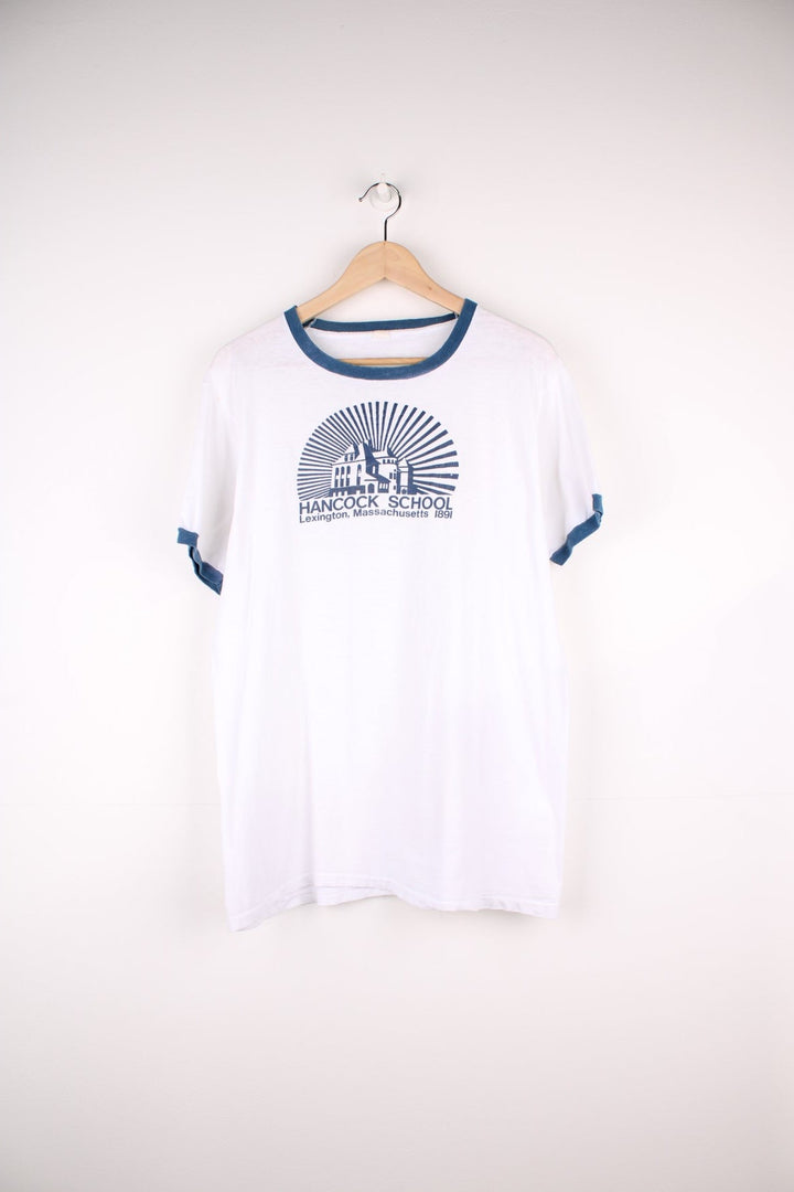 Vintage Hancock School Massachusetts Ringer T-Shirt in a white and blue colourway with the school graphic and spell out printed on the front. 