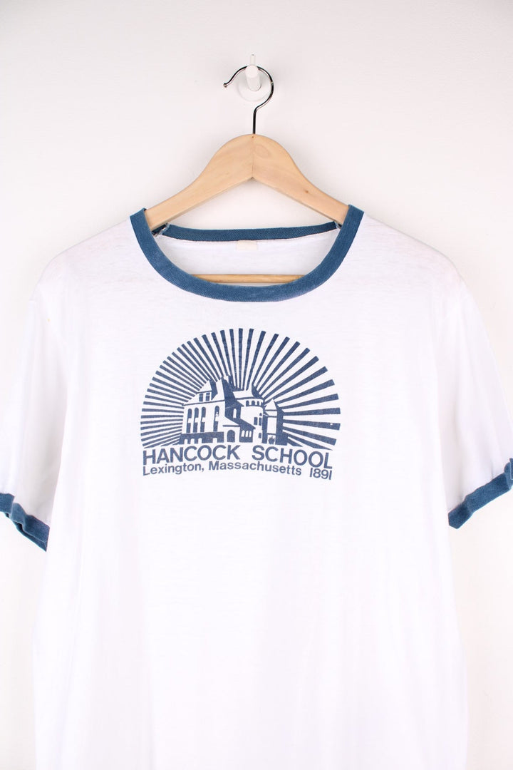 Vintage Hancock School Massachusetts Ringer T-Shirt in a white and blue colourway with the school graphic and spell out printed on the front. 