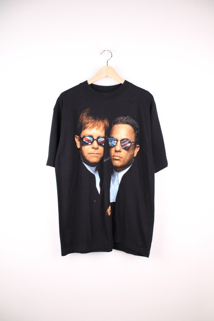 Vintage 1994 Billy Joel & Elton John Face to Face T-Shirt in a black colourway with the artists printed on the front. 