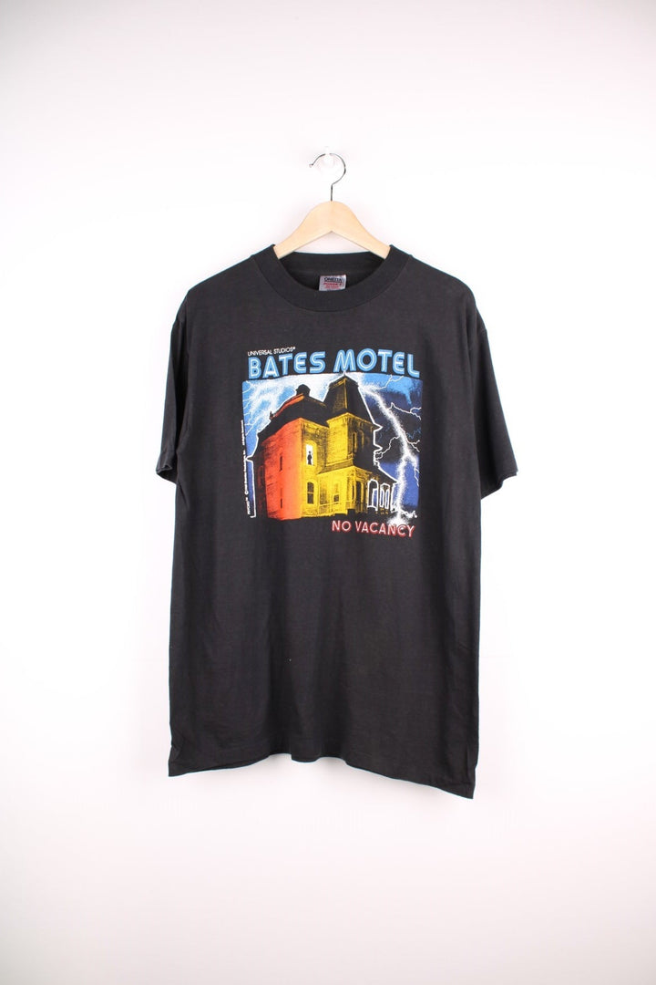 Vintage 90's Bates Motel Psycho T-Shirt in a black colourway with the films art printed on the front. 