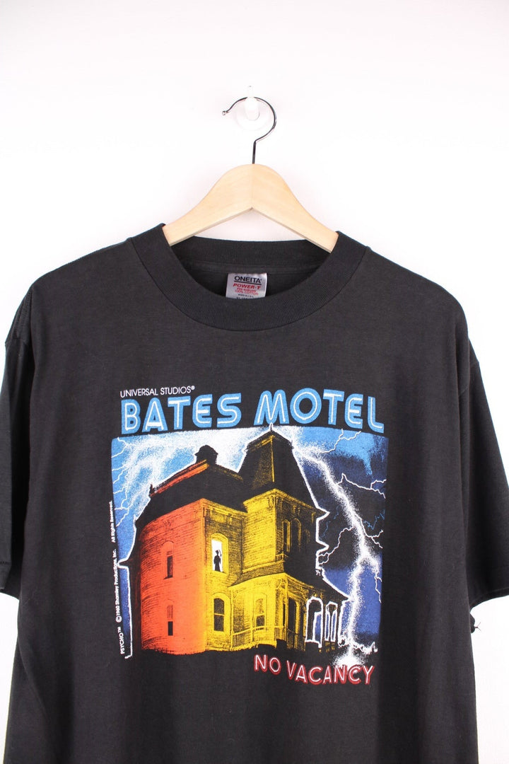 Vintage 90's Bates Motel Psycho T-Shirt in a black colourway with the films art printed on the front. 