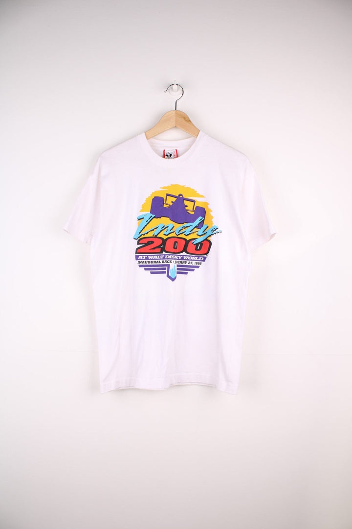 1996 Disney World Race Graphic T-Shirt in a white colourway with the logo printed on the front and on the back a graphic of all the cars.