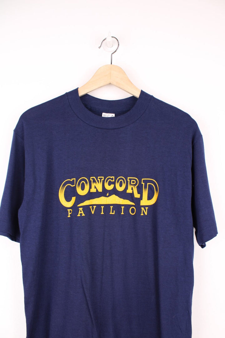 Vintage 1980s Concord Pavilion single stitch T-Shirt with printed yellow logo across the chest.