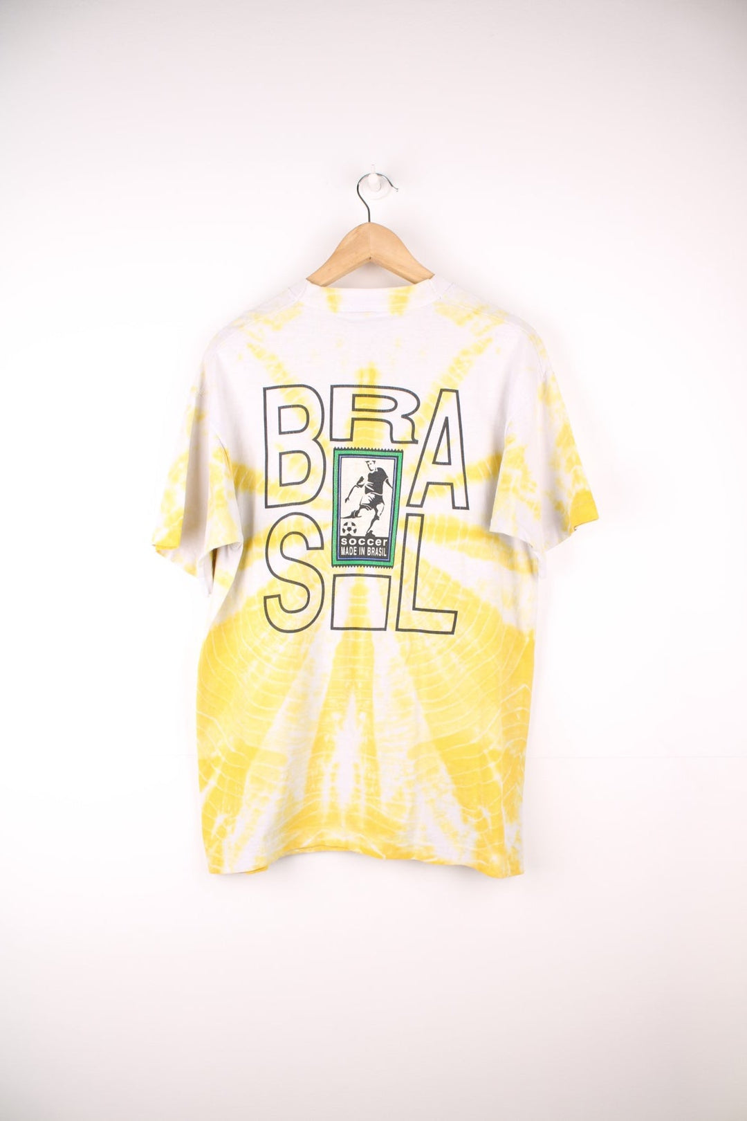 World Cup USA 1994 team Brasil tee in yellow tie-dye with flag crest graphic on the front and Brasil spellout on the back. 