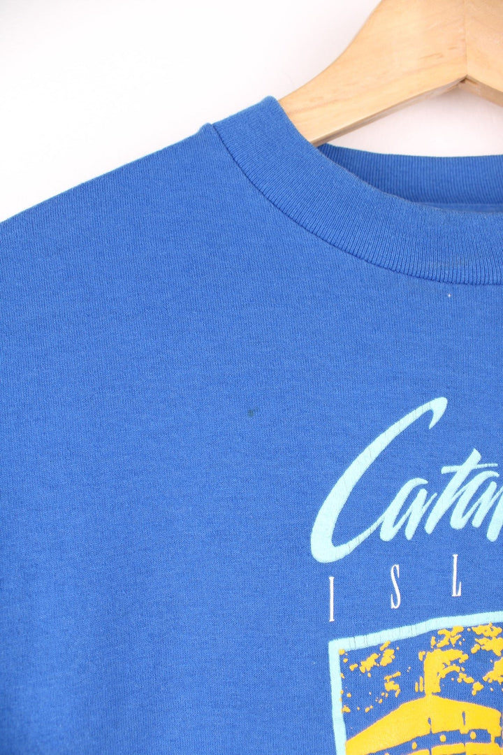 1988 Catalina Island Triathlon long-sleeved tee in blue with pink and yellow abstract designs. 