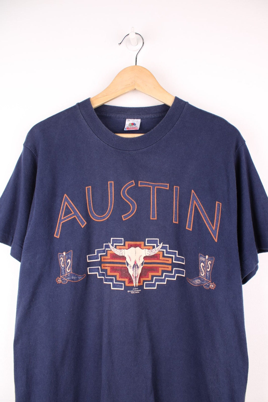 Navy blue Austin spellout tee with cow skull and cowboy boot design. 