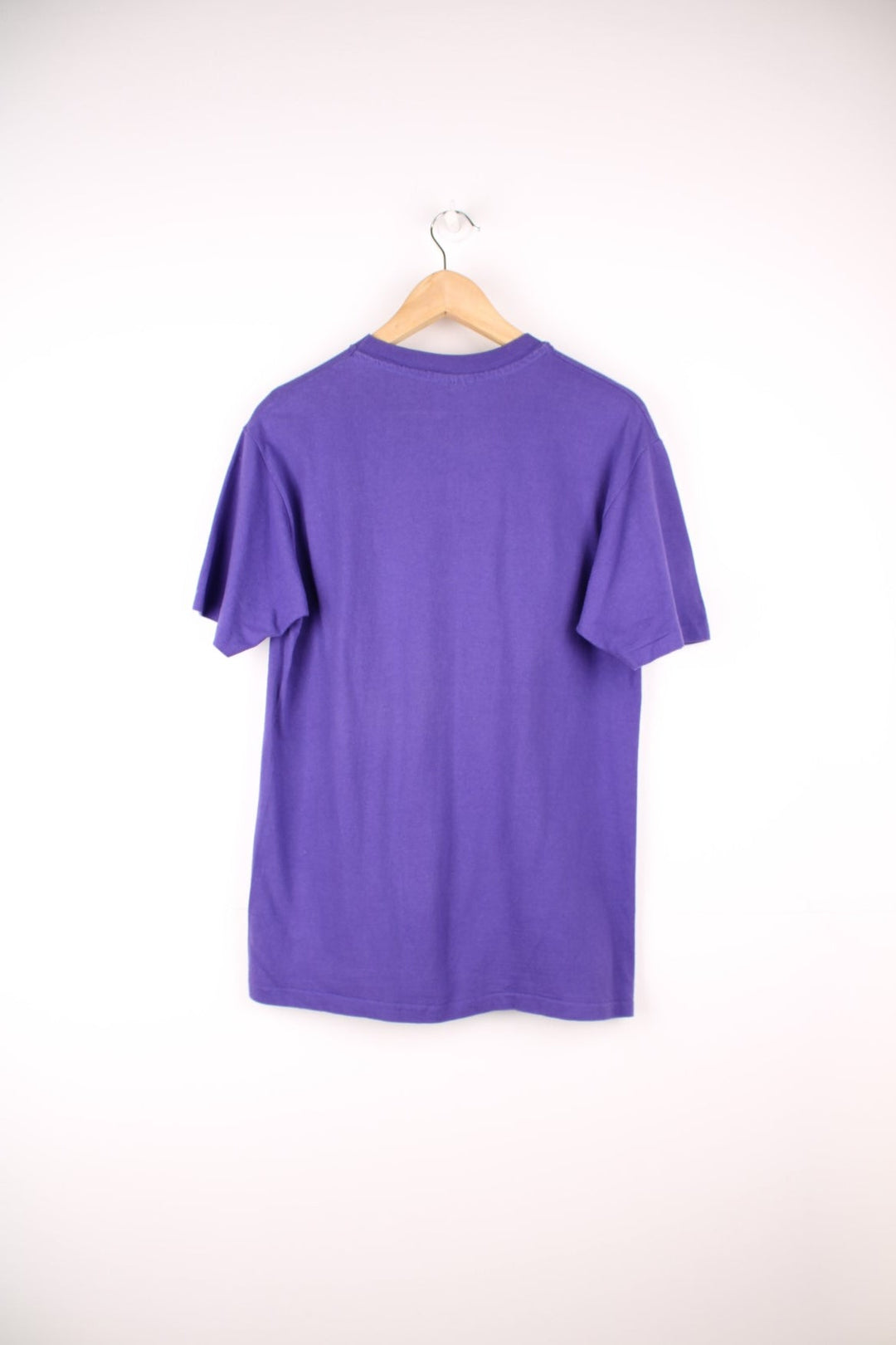 Purple Florida spellout tee with geometric designs. 