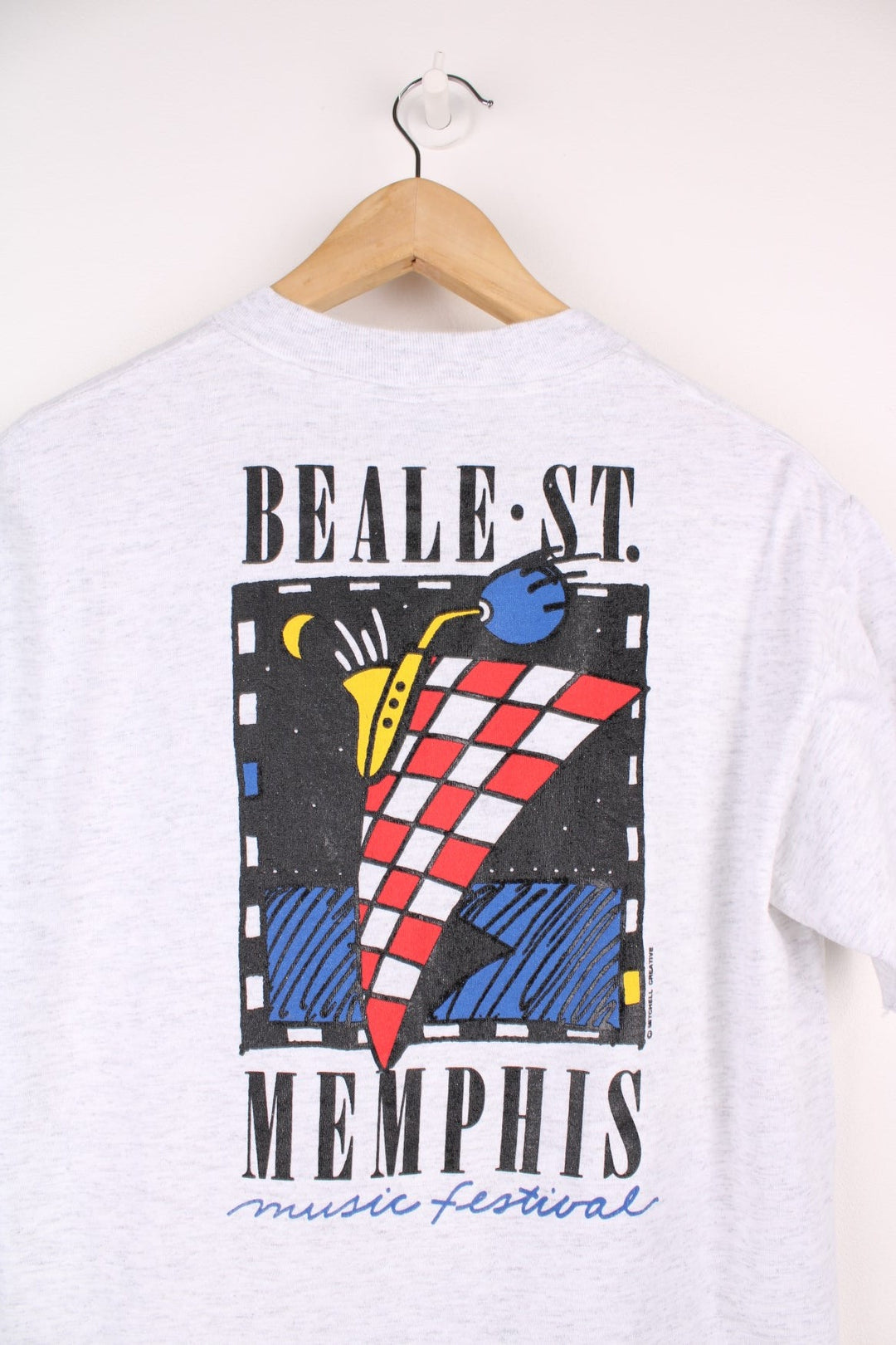 Grey Beale St. Music festival tee with spellout on the pocket and geometric graphic on the back. 