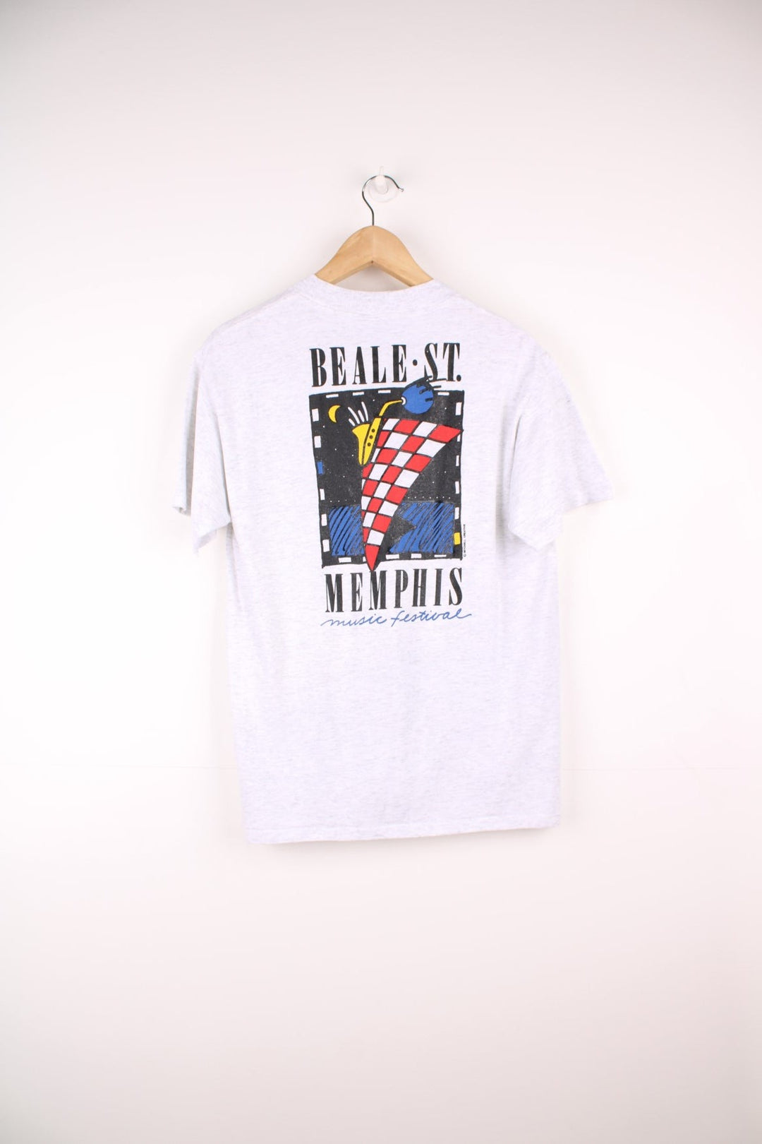 Grey Beale St. Music festival tee with spellout on the pocket and geometric graphic on the back. 