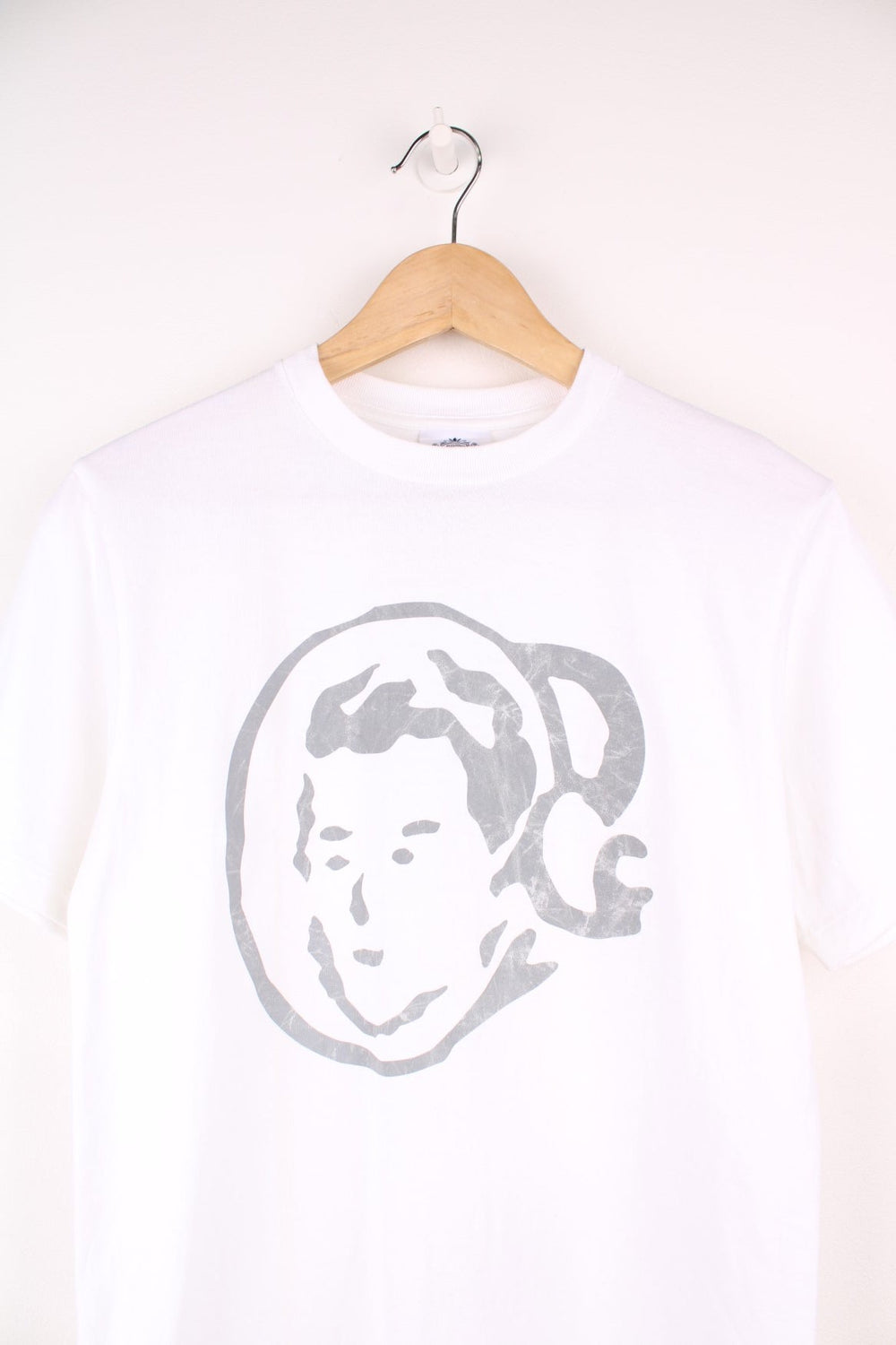 White Billionaire Boy's Club tee with face design in grey and logo on the back. 