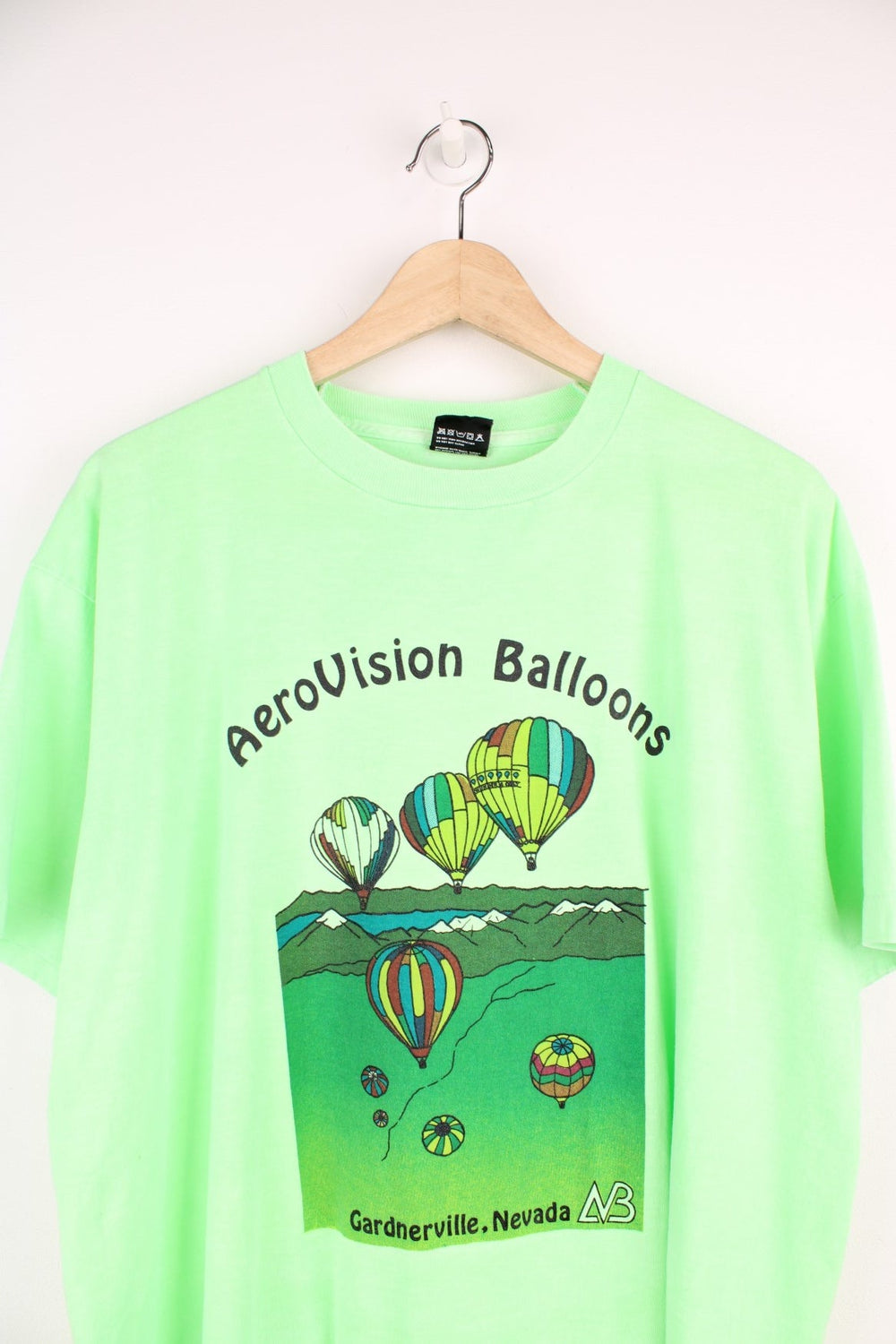 Vintage green tee with hot air balloon graphic and spellout reading 'AeroVision Balloons Gardnerville, Nevada'.