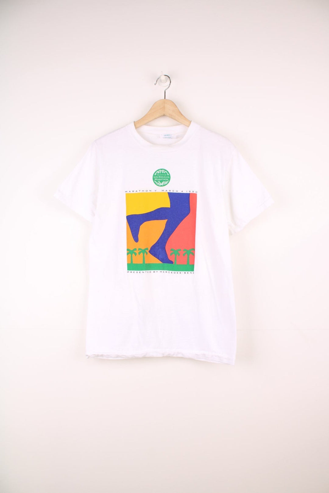 1990 'The City of Los Angeles Marathon' tee with colourful sunset graphic and text reading 'Marathon V March 4 1990, Presented by Mercedes' and a large blue Mercedes logo on the back. 