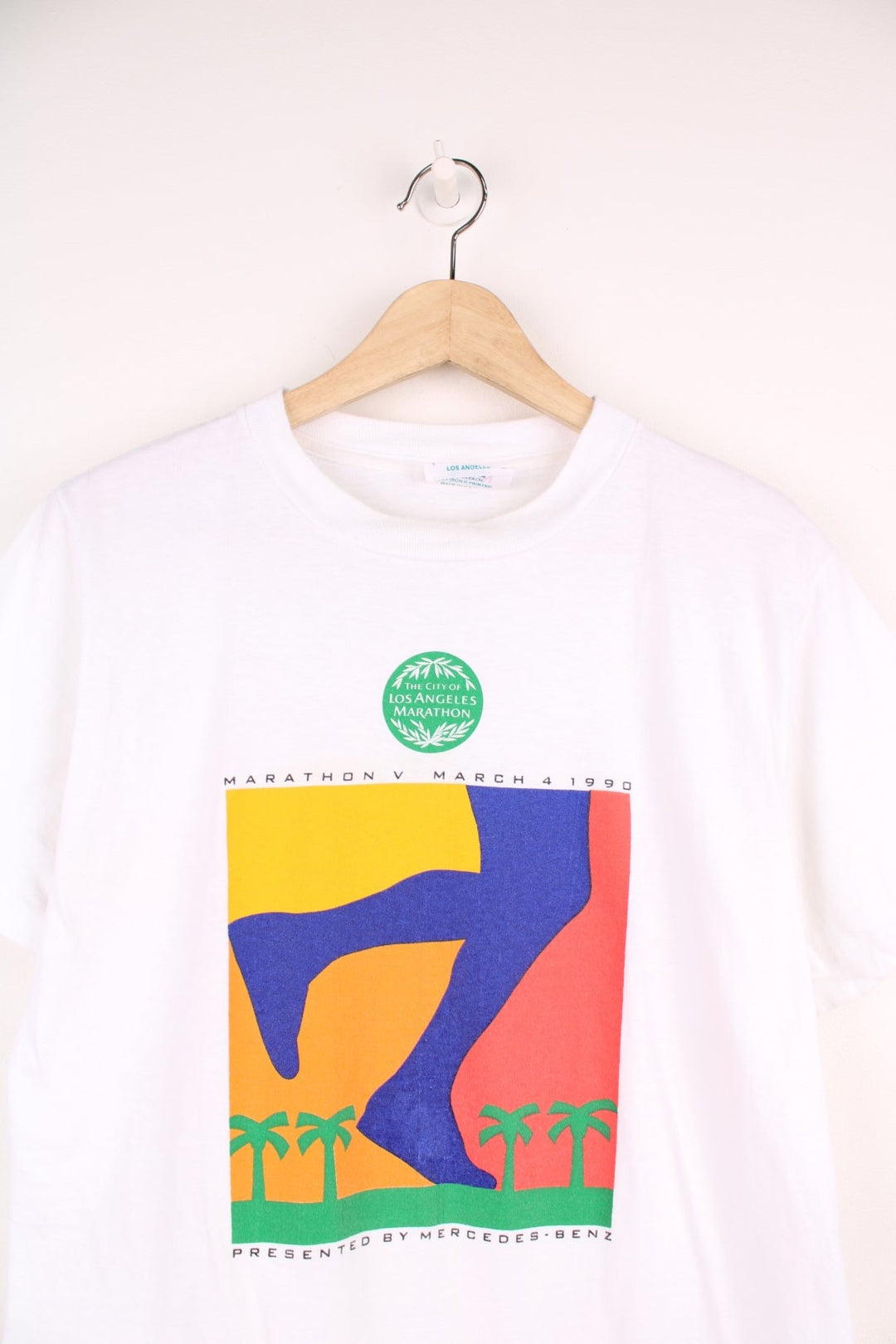 1991 'The City of Los Angeles Marathon' tee with colourful sunset graphic and text reading 'Marathon V March 4 1990, Presented by Mercedes' and a large blue Mercedes logo on the back.