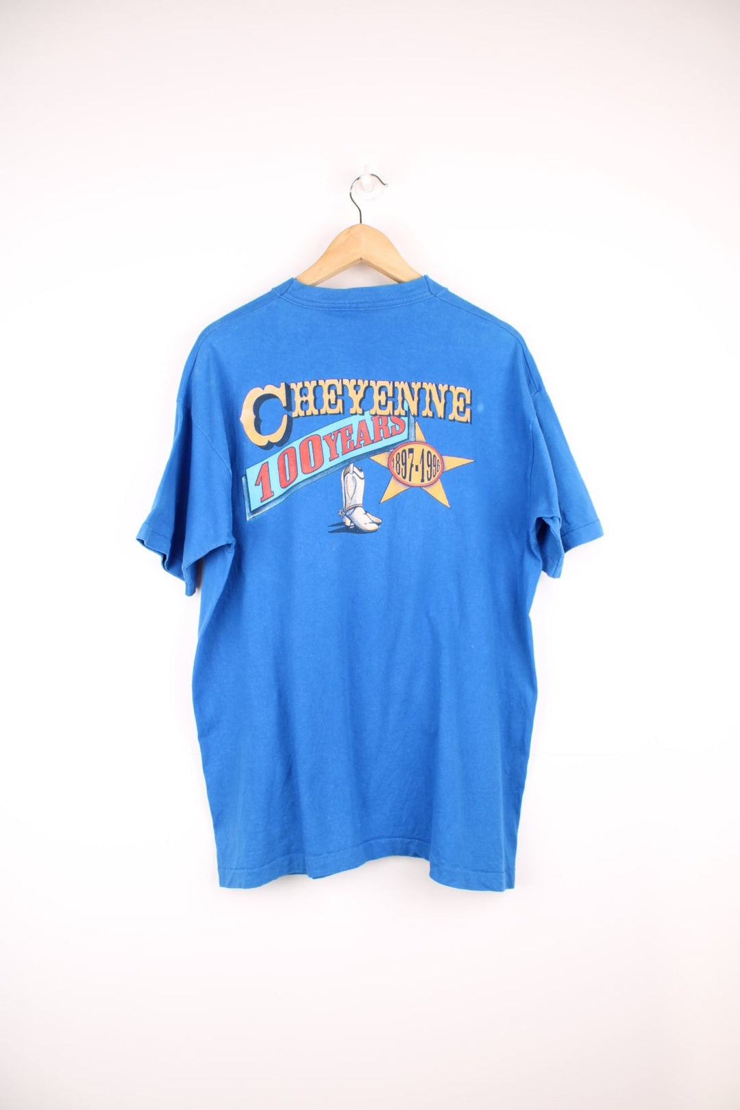 Vintage 1996 Cheyenne Cowboy, 100 Year Anniversary graphic t-shirt in a bright blue colourway. Features single stitching on the sleeves and printed motif on the front and back