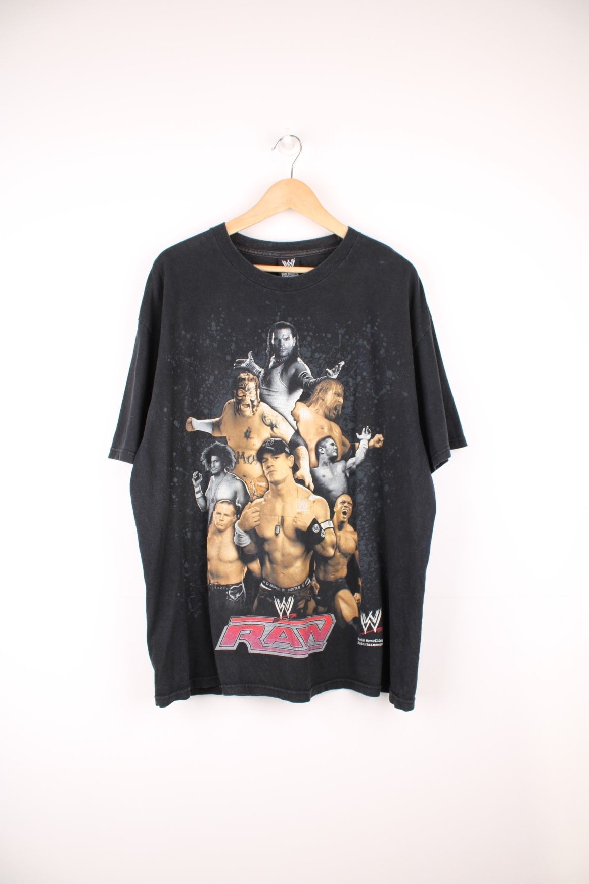 2007 WWE "RAW" faded black t-shirt, features large printed graphic of a collection of wrestlers on the front