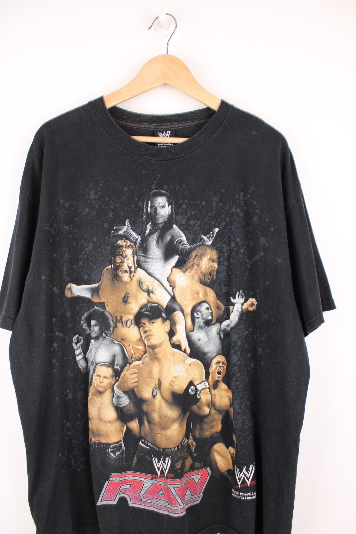 2008 WWE "RAW" faded black t-shirt, features large printed graphic of a collection of wrestlers on the front