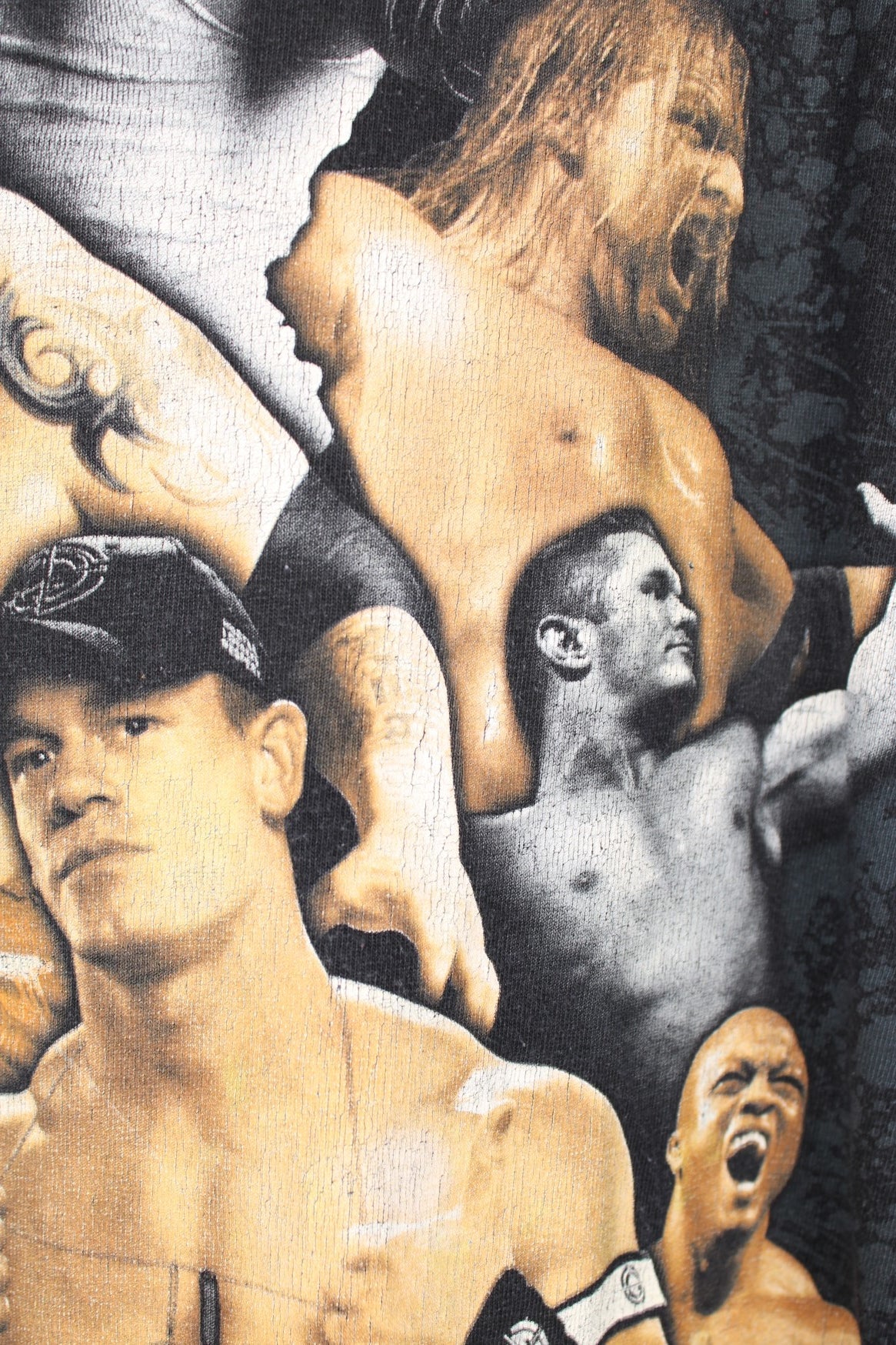 2009 WWE "RAW" faded black t-shirt, features large printed graphic of a collection of wrestlers on the front