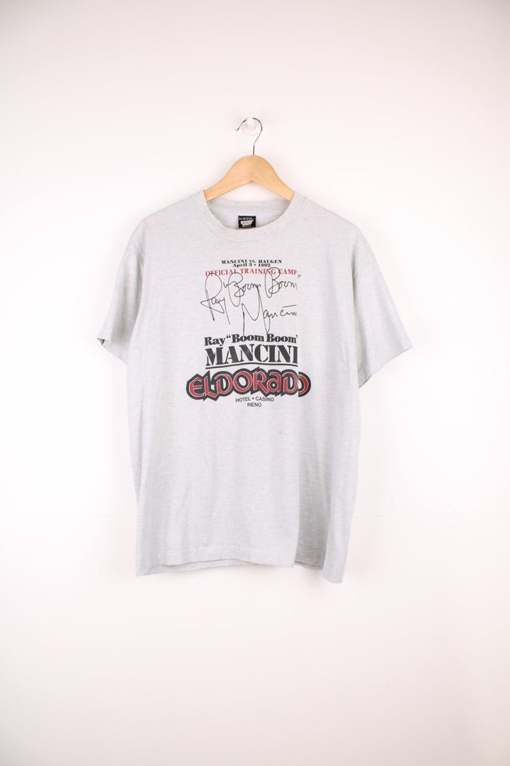 Vintage 1992 Ray 'Boom Boom' Mancini for the Eldarado Casino grey graphic t-shirt by Screen Starts Best. Features large spell-out details on the front.